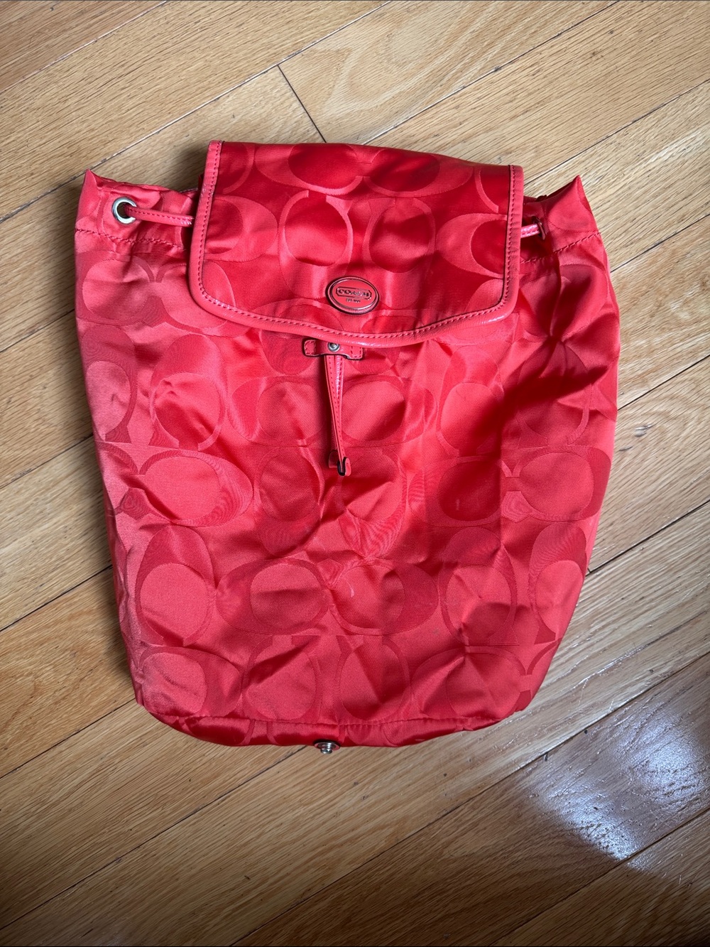 Coach Signature Getaway Nylon Drawstring Backpack in vermillion (orange) / gold
